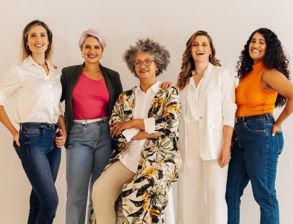 Group of women standing and laughing together