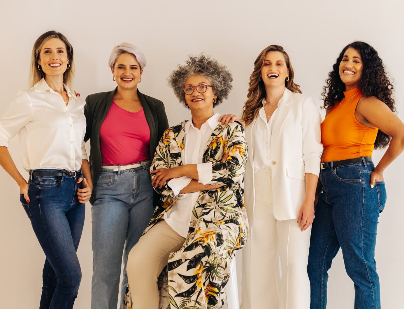 Group of women standing and laughing together