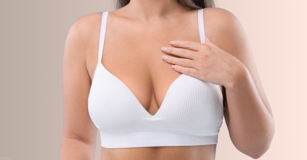 Confident woman in white bra. (Model)